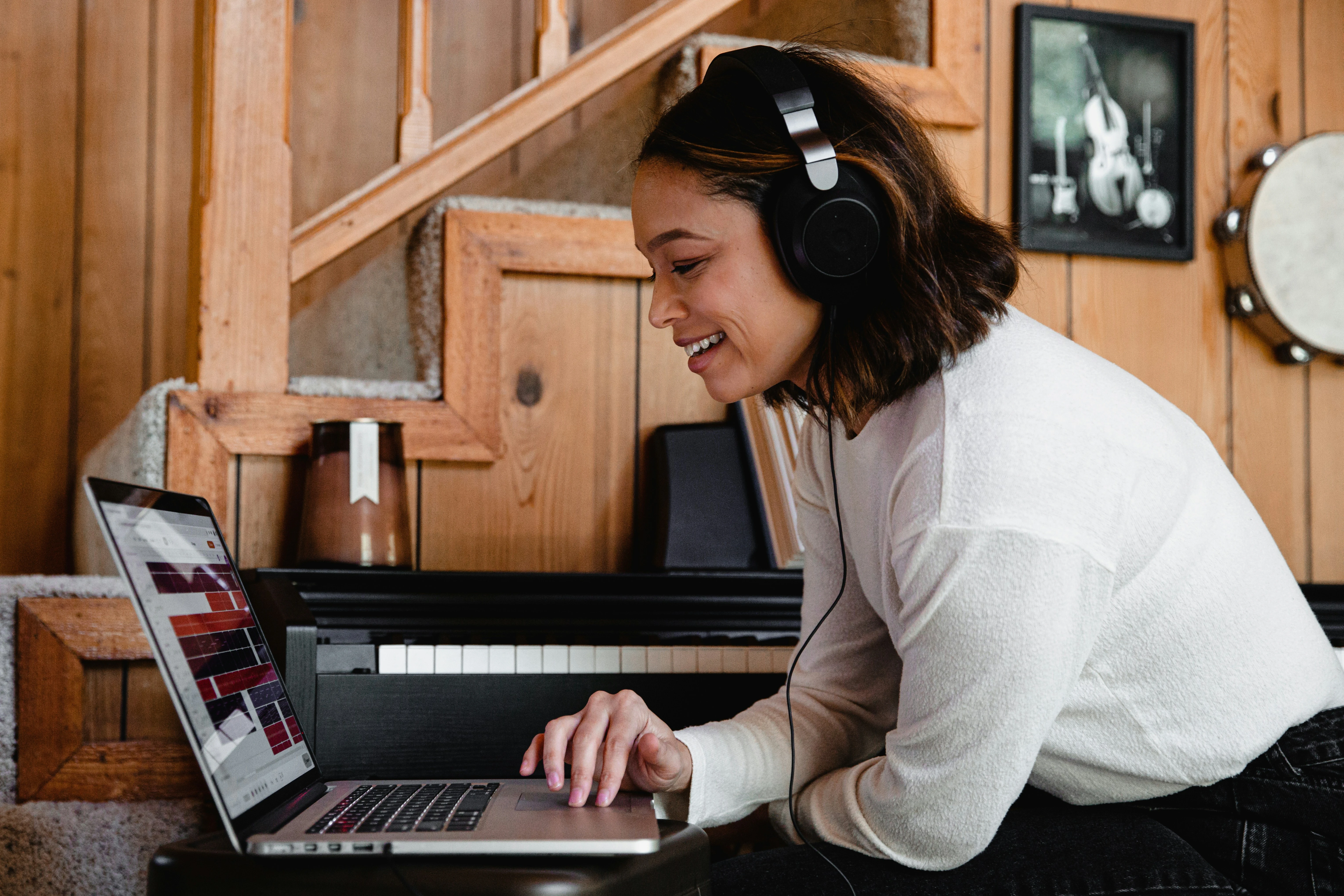 Student wearing headphones preparing for IELTS and PTE with a laptop